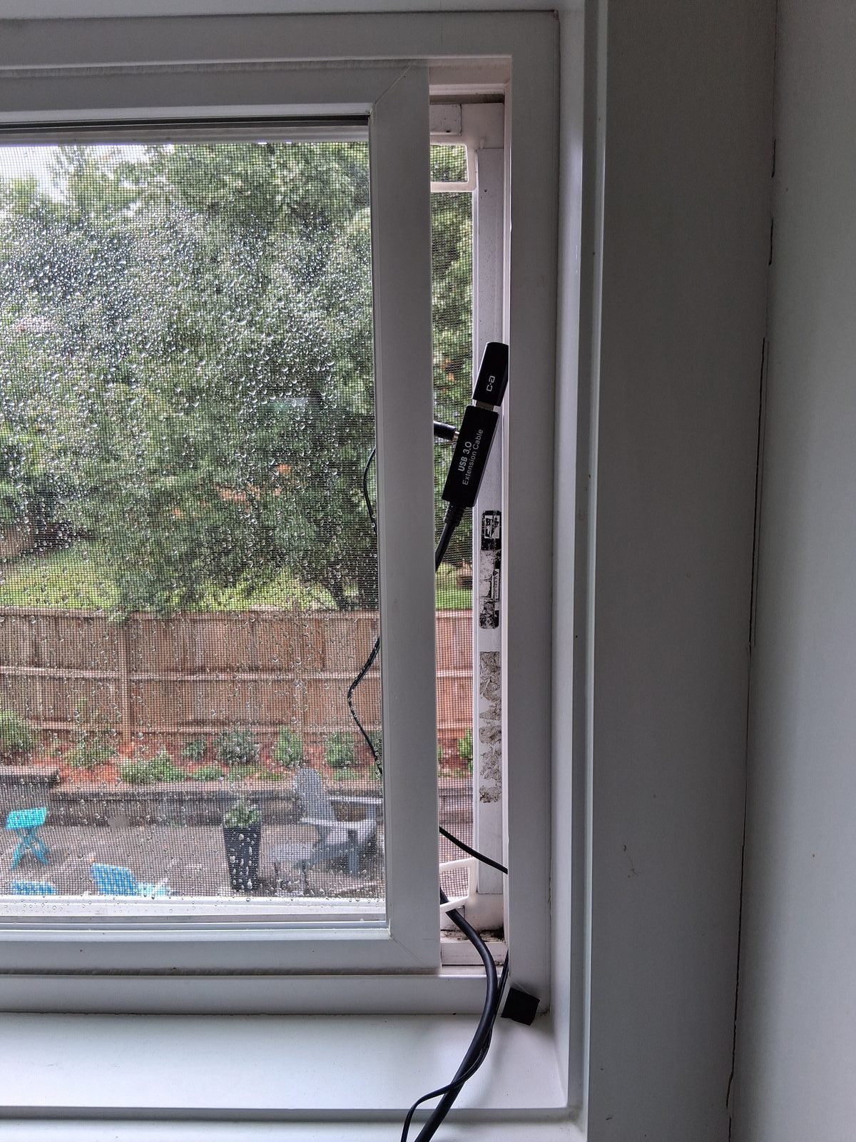 USB mic wedged in kitchen window